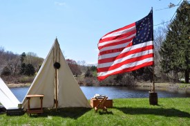 Re-enactment camp by the pond